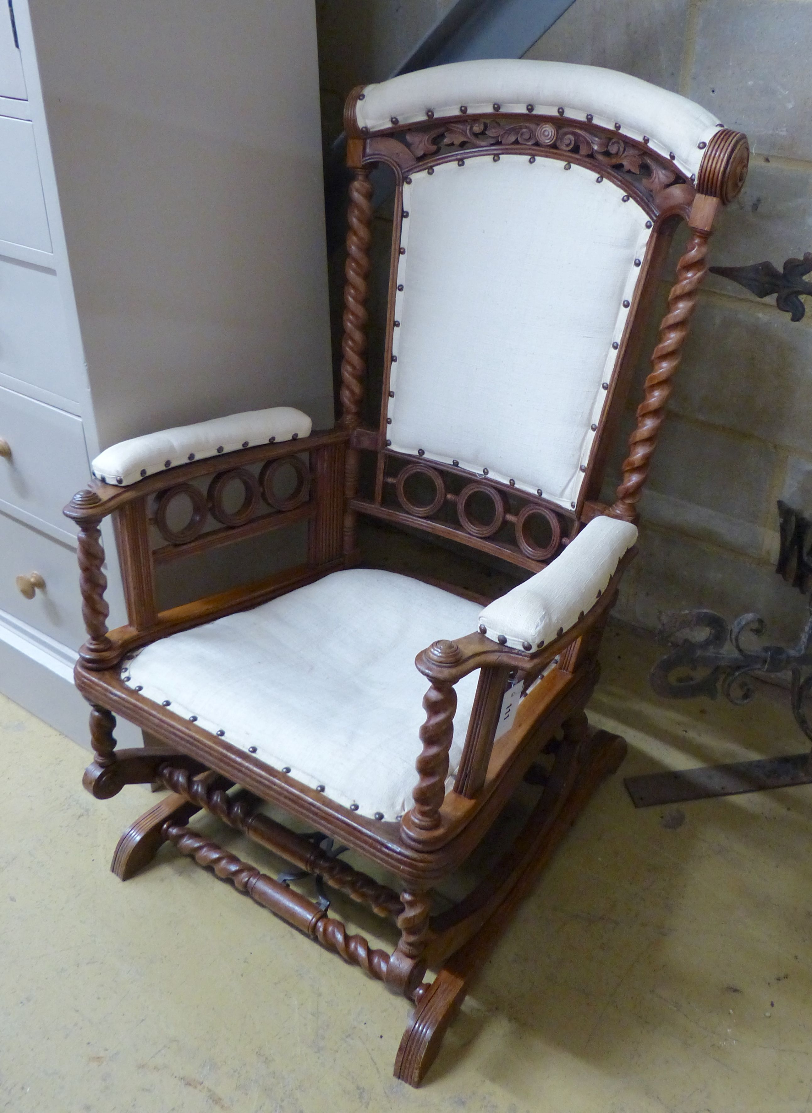 A late 19th century American walnut rocking chair